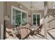 Enclosed patio includes brick flooring, ceiling fan, and outdoor seating area at 17807 Crystal Cove Pl, Lutz, FL 33548