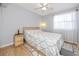 Serene bedroom with a ceiling fan, natural light, and comfortable furnishings at 1824 Clearbrooke Dr, Clearwater, FL 33760