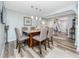 Stylish dining area with pendant lighting and a granite-topped island and comfortable seating at 1824 Clearbrooke Dr, Clearwater, FL 33760