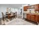 Dining room adjacent to a kitchen with wood cabinets and stainless steel appliances at 1824 Clearbrooke Dr, Clearwater, FL 33760