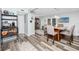 Modern dining room with sleek flooring and seating for four at the island at 1824 Clearbrooke Dr, Clearwater, FL 33760