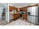 Well-equipped kitchen featuring stainless steel appliances and ample cabinet space at 1824 Clearbrooke Dr, Clearwater, FL 33760