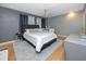 Comfortable main bedroom with grey walls, ceiling fan, and a spacious layout at 1824 Clearbrooke Dr, Clearwater, FL 33760