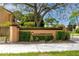 Clearbrooke entrance sign framed by manicured shrubs and landscaping creating a welcoming community at 1824 Clearbrooke Dr, Clearwater, FL 33760