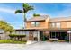 Inviting townhouse with a carport, featuring a covered patio, and convenient parking spaces at 1824 Clearbrooke Dr, Clearwater, FL 33760