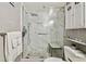 Modern bathroom features a walk-in shower with marble walls and a built-in shower bench at 2042 Australia W Way # 6, Clearwater, FL 33763