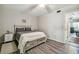 Cozy bedroom featuring stylish furnishings and a ceiling fan, creating a comfortable retreat at 2042 Australia W Way # 6, Clearwater, FL 33763