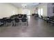 Bright classroom with tables, chairs, and a projection screen at 2042 Australia W Way # 6, Clearwater, FL 33763