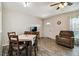 A dining area with a table and chairs with a view into the living room and front entrance at 2042 Australia W Way # 6, Clearwater, FL 33763