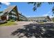Unique condo complex with manicured landscaping and plenty of parking on a sunny day at 2042 Australia W Way # 6, Clearwater, FL 33763