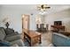 Open-concept living area with neutral walls and wood-look floors seamlessly flowing into the dining area at 2042 Australia W Way # 6, Clearwater, FL 33763