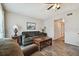 Bright living room features modern ceiling fan, comfortable sofa, two side tables, and decorative lamps at 2042 Australia W Way # 6, Clearwater, FL 33763