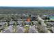 Expansive aerial shot of a residential area, showcasing single-Gathering homes with lush greenery; providing a serene and well-maintained environment at 2082 Sifield Greens Way # 3, Sun City Center, FL 33573