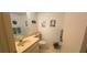 Bathroom with a vanity, commode, and nautical décor that gives a seaside ambience at 2222 Norwegian Dr # 24, Clearwater, FL 33763