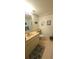 A full bathroom featuring a vanity, toilet and mirror with neutral colored floor at 2222 Norwegian Dr # 24, Clearwater, FL 33763