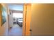 View of bedroom with neutral carpet and walls, a bed and an open door at 2222 Norwegian Dr # 24, Clearwater, FL 33763