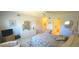 Bright bedroom featuring white walls, neutral carpet, and a coordinated bed and furniture set at 2222 Norwegian Dr # 24, Clearwater, FL 33763