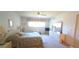 A bright bedroom with neutral carpet, a coordinated bed set and furniture set at 2222 Norwegian Dr # 24, Clearwater, FL 33763