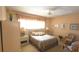 Comfortable bedroom featuring cozy decor and natural lighting at 2222 Norwegian Dr # 24, Clearwater, FL 33763
