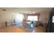Dining area with tile flooring, table with seating, and a relaxing chair at 2222 Norwegian Dr # 24, Clearwater, FL 33763
