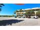 Inviting exterior view of a multi-story building with palm trees and ample parking at 2222 Norwegian Dr # 24, Clearwater, FL 33763