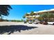 Inviting exterior view of a multi-story building with palm trees and ample parking at 2222 Norwegian Dr # 24, Clearwater, FL 33763