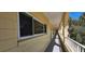 Exterior hallway of building with window views and protective railing at 2222 Norwegian Dr # 24, Clearwater, FL 33763