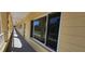 Exterior hallway of building with window views and protective railing at 2222 Norwegian Dr # 24, Clearwater, FL 33763