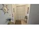 Welcoming foyer with tile flooring, decorative mirror, and convenient coat closet at 2222 Norwegian Dr # 24, Clearwater, FL 33763