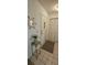 Inviting foyer with neutral tile flooring, decorative mirror and convenient coat closet at 2222 Norwegian Dr # 24, Clearwater, FL 33763