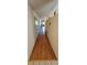 Inviting hallway with wood floors and views into a comfortable living space at 2222 Norwegian Dr # 24, Clearwater, FL 33763