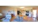 Bright kitchen and dining area with black appliances and seating for four at 2222 Norwegian Dr # 24, Clearwater, FL 33763