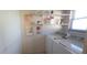 Laundry room featuring a washer, dryer, shelves, and a bright window at 2222 Norwegian Dr # 24, Clearwater, FL 33763