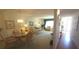 Cozy living room featuring carpeted floors and bright decor with dining area at 2222 Norwegian Dr # 24, Clearwater, FL 33763