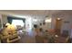 Comfortable living room features plush seating, bright decor, and dining area at 2222 Norwegian Dr # 24, Clearwater, FL 33763