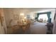 Inviting living room with neutral carpeting, comfortable seating, and bright lighting at 2222 Norwegian Dr # 24, Clearwater, FL 33763