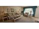 Comfortable living room features a relaxing seating area and great natural light at 2222 Norwegian Dr # 24, Clearwater, FL 33763