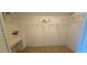 Spacious walk-in closet featuring shelving and storage, with neutral colored carpet at 2222 Norwegian Dr # 24, Clearwater, FL 33763