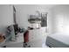 Bedroom featuring a mounted TV, desk setup, and a comfortable bed at 2233 Golf Manor Blvd, Valrico, FL 33596