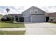 Charming two-story home with well-maintained landscaping and a spacious two car garage at 2233 Golf Manor Blvd, Valrico, FL 33596