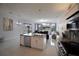 Modern kitchen features granite countertops, stainless steel appliances, and an island with a breakfast bar at 2233 Golf Manor Blvd, Valrico, FL 33596