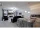 Open concept kitchen with a gray marble island, modern fixtures, and views to the living area at 2233 Golf Manor Blvd, Valrico, FL 33596