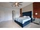 Spacious bedroom featuring a high ceiling fan, contemporary decor, and luxurious accents at 2233 Golf Manor Blvd, Valrico, FL 33596