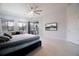 Spacious main bedroom with natural light, tile floors, and a large window overlooking the screened porch at 2233 Golf Manor Blvd, Valrico, FL 33596