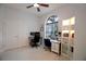 Bright office space featuring two desks, a large window, and a built-in bookcase at 2233 Golf Manor Blvd, Valrico, FL 33596