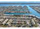 Aerial view of the community with waterfront access to the channel and the Gulf at 238 Sun Ketch Ct # 95, Treasure Island, FL 33706