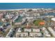 Aerial view showcases property with waterfront access and proximity to beaches at 238 Sun Ketch Ct # 95, Treasure Island, FL 33706