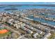 Community aerial view showing lush landscaping, scenic waterways, and nearby amenities at 238 Sun Ketch Ct # 95, Treasure Island, FL 33706