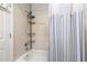 Clean bathroom highlighting a shower-tub combination and shelving for toiletries in a compact design at 238 Sun Ketch Ct # 95, Treasure Island, FL 33706