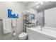 Well-lit bathroom featuring a modern vanity, large mirror, ample storage, and a shower/tub combination at 238 Sun Ketch Ct # 95, Treasure Island, FL 33706